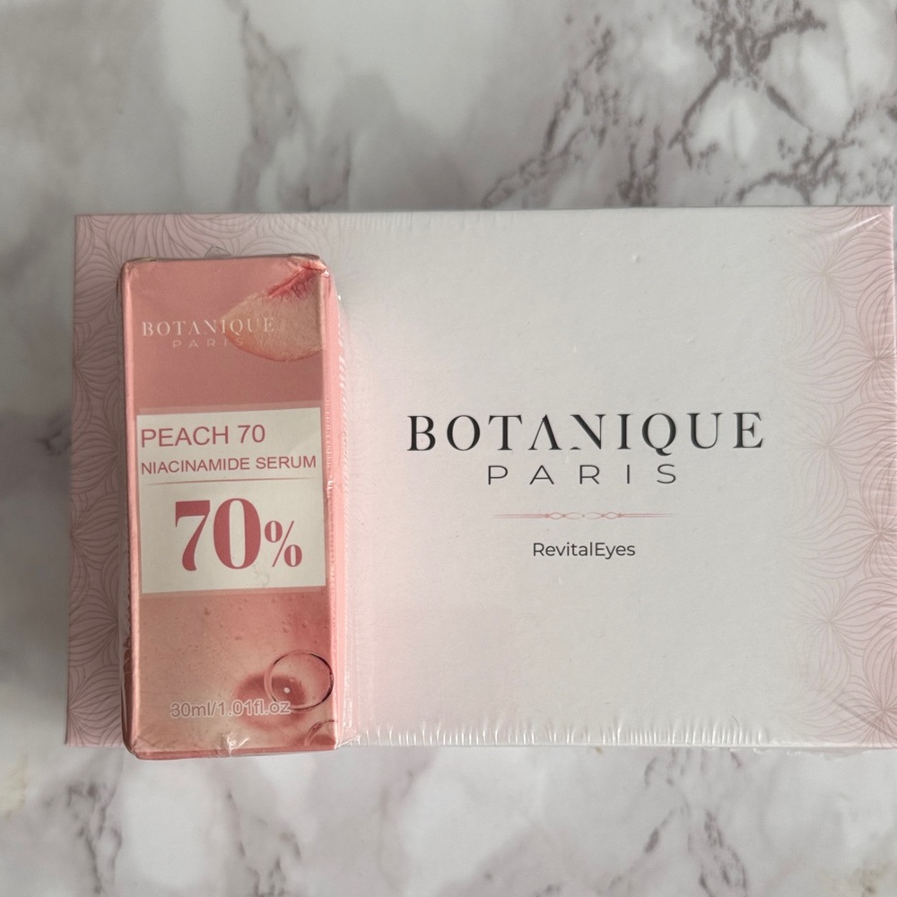 Botanique Paris RevitalEyes red light therapy device and  70 Niacinamide Serum